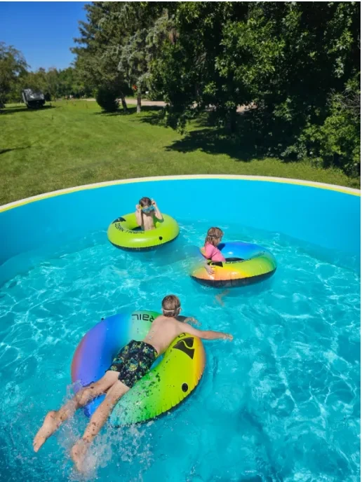 Family using a seasonal pool in a garden